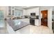 Well-lit kitchen showcasing white cabinets, granite countertops, and stainless steel appliances at 3409 Pondview Ln, Charlotte, NC 28210
