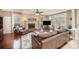 Bright living room featuring hardwood floors, fireplace, and large windows that flood the space with light at 3409 Pondview Ln, Charlotte, NC 28210