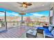 Back porch featuring outdoor seating, ceiling fan, and beautiful backyard view at 345 Somerled Way, Waxhaw, NC 28173