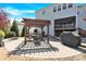 Backyard view featuring a pergola with outdoor seating, a grill and a partially-covered patio at 345 Somerled Way, Waxhaw, NC 28173