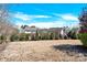 Large backyard with mature trees and landscaping, offering a serene and private outdoor space at 345 Somerled Way, Waxhaw, NC 28173