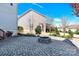 Backyard view featuring a stone patio with a fire pit and mature landscaping at 345 Somerled Way, Waxhaw, NC 28173