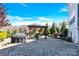 Backyard featuring a grill, a pergola with outdoor seating, mature trees, and stone pavers at 345 Somerled Way, Waxhaw, NC 28173