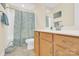 Cozy bathroom featuring a shower/tub, wood vanity, and nautical themed shower curtain at 345 Somerled Way, Waxhaw, NC 28173