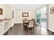 Dining room showcasing a wooden table, six chairs, and a sliding glass door to the outdoor patio at 345 Somerled Way, Waxhaw, NC 28173