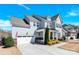 Charming two-story home with a well-manicured lawn, showcasing its architectural design at 345 Somerled Way, Waxhaw, NC 28173