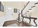 Welcoming foyer with hardwood floors, staircase, and a decorative table, creating an inviting entrance at 345 Somerled Way, Waxhaw, NC 28173
