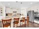 Spacious kitchen with a large island, stainless steel appliances, and bar stool seating at 345 Somerled Way, Waxhaw, NC 28173