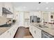 Bright kitchen with granite countertops, stainless steel appliances, and ample cabinet space at 345 Somerled Way, Waxhaw, NC 28173
