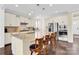Well-appointed kitchen with granite countertops, stainless steel appliances, and a large central island at 345 Somerled Way, Waxhaw, NC 28173