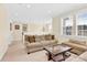 Inviting living room with natural light, neutral carpet, and comfortable seating at 345 Somerled Way, Waxhaw, NC 28173