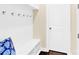 Mudroom featuring a white bench with storage, hooks for coats, and a white door at 345 Somerled Way, Waxhaw, NC 28173