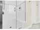 Modern walk-in shower with white subway tile, glass door, and built-in bench at 345 Somerled Way, Waxhaw, NC 28173