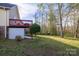 Expansive backyard featuring a deck, walkout basement access, and mature trees at 3704 25Th Street Ne Pl, Hickory, NC 28601