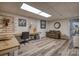 Finished basement with wood-look flooring, recessed lighting, and a brown couch at 3704 25Th Street Ne Pl, Hickory, NC 28601