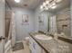 Bathroom features a shower-tub combo, vanity with sink, and neutral décor at 3704 25Th Street Ne Pl, Hickory, NC 28601