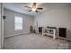 Carpeted bedroom with a ceiling fan, window, and music equipment at 3704 25Th Street Ne Pl, Hickory, NC 28601