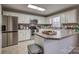 Bright kitchen with stainless steel appliances, white cabinetry, and a breakfast bar at 3704 25Th Street Ne Pl, Hickory, NC 28601