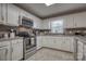 White cabinetry and stainless steel appliances offer a clean, modern feel to this kitchen at 3704 25Th Street Ne Pl, Hickory, NC 28601