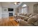 Comfortable living room featuring a fireplace, large window, and stylish decor at 3704 25Th Street Ne Pl, Hickory, NC 28601