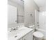 A white bathroom featuring a shower-tub combo, toilet, vanity, and chrome hardware at 416 E Park Ave, Gastonia, NC 28054