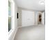 A bedroom with large wardrobe and an open door leading to another room at 416 E Park Ave, Gastonia, NC 28054