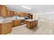 Spacious kitchen featuring stainless appliances, a center island, and sleek countertops at 416 E Park Ave, Gastonia, NC 28054