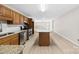 Modern kitchen with stainless steel appliances, center island, and open access to living areas at 416 E Park Ave, Gastonia, NC 28054