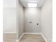 Laundry area with wood-look floors and hookups for washer and dryer at 416 E Park Ave, Gastonia, NC 28054