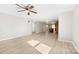 Spacious living room featuring modern flooring and an open layout to kitchen and dining areas at 416 E Park Ave, Gastonia, NC 28054