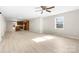 Bright open-plan living room with ceiling fan, hardwood floors and views of the kitchen at 416 E Park Ave, Gastonia, NC 28054