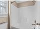 Bright white tub and shower combination with window at 4231 Brushy Knl, York, SC 29745