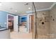 Bathroom with a luxurious tub, glass shower, tile surround, and natural light from a window at 4231 Brushy Knl, York, SC 29745