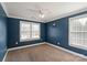 Bedroom featuring neutral carpet, blue walls, and large windows at 4231 Brushy Knl, York, SC 29745
