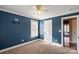 Bedroom featuring neutral carpet, blue walls, and a ceiling fan at 4231 Brushy Knl, York, SC 29745