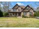 Charming two-story brick home with a well-manicured lawn and inviting covered front porch at 4231 Brushy Knl, York, SC 29745
