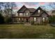 Stately brick home with a well-manicured lawn and a welcoming front porch provides a grand curb appeal at 4231 Brushy Knl, York, SC 29745