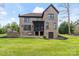 Beautiful brick home featuring a stone patio, outdoor kitchen, and screened in porch, perfect for entertaining at 4231 Brushy Knl, York, SC 29745