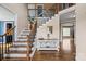 Elegant foyer with hardwood floors, a staircase with decorative runners, and stylish accents at 4231 Brushy Knl, York, SC 29745