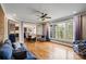 Spacious living room with hardwood floors, large windows, and open access to the dining area at 4231 Brushy Knl, York, SC 29745