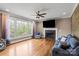 Bright living room with hardwood floors, fireplace, large windows, and comfortable seating at 4231 Brushy Knl, York, SC 29745