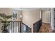 An elegant staircase with decorative railing and lighting leads to the upper level of the home at 4231 Brushy Knl, York, SC 29745