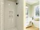 Modern shower with white subway tiles and built-in shelves, adjoining a luxurious bathroom at 472 Oak Rd # 114/115/116, Norwood, NC 28128