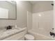 This bathroom features a white vanity with a granite countertop and a shower-tub combination at 472 Oak Rd # 114/115/116, Norwood, NC 28128