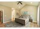 Virtually staged bedroom features wood floors, neutral paint, and vaulted ceiling at 472 Oak Rd # 114/115/116, Norwood, NC 28128