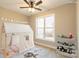 Bright, staged bedroom with a large window, a play tent and neutral tones throughout at 472 Oak Rd # 114/115/116, Norwood, NC 28128