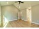 Bright bedroom featuring vaulted ceiling, modern ceiling fan, and hardwood floors at 472 Oak Rd # 114/115/116, Norwood, NC 28128