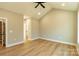 Empty bedroom with wood floors, neutral paint, and vaulted ceiling at 472 Oak Rd # 114/115/116, Norwood, NC 28128