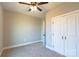 Neutral bedroom with double door closet, ceiling fan, and soft carpet flooring at 472 Oak Rd # 114/115/116, Norwood, NC 28128