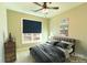 Staged bedroom showcasing a vintage style, black metal bed frame, and custom wall decor at 472 Oak Rd # 114/115/116, Norwood, NC 28128